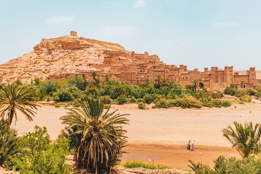 Aït Benhaddou kasbah in Morocco — UNESCO ksar fortress at golden hour, clay-brick architecture against High Atlas backdrop