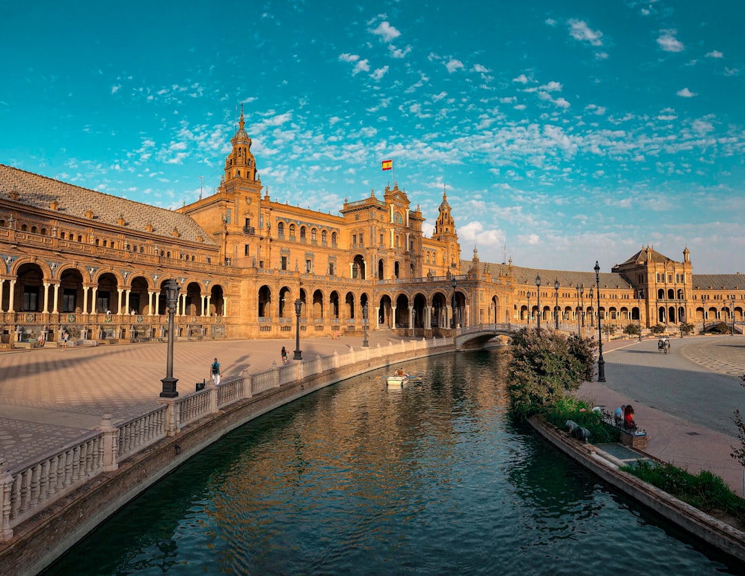 Seville Plaza de España — semicircular Renaissance Revival plaza, the central Andalusia stop on a Spain Portugal Morocco itinerary