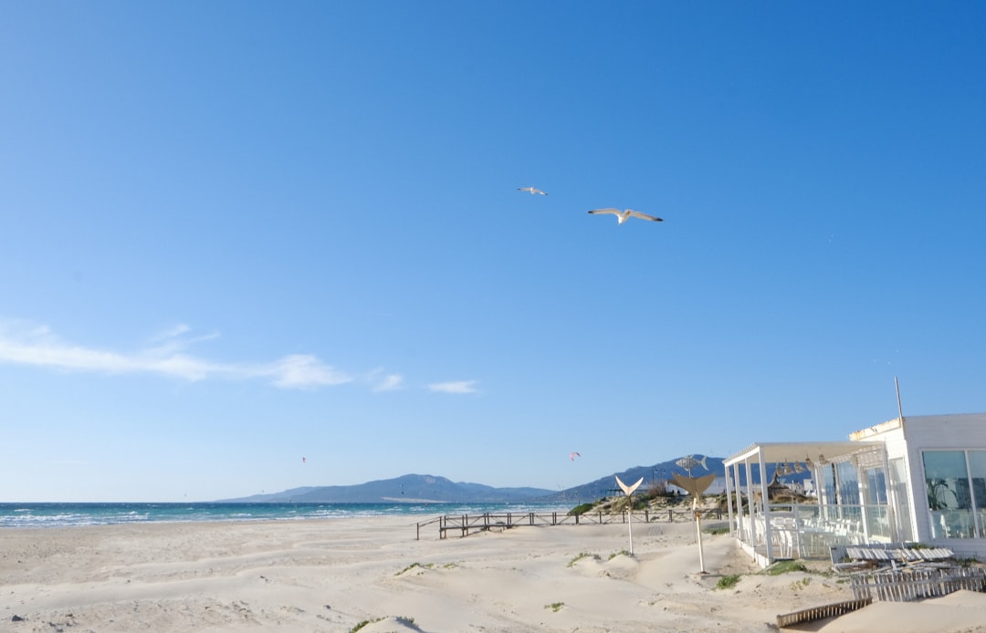 View from Tarifa Spain to Morocco — Strait of Gibraltar with Moroccan Rif Mountains visible on the horizon