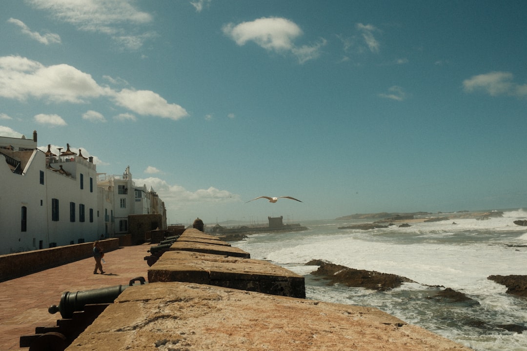 Essaouira surf city — UNESCO ramparts and fishing port with kitesurfers on the windy Atlantic bay