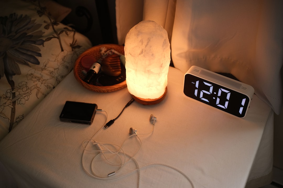Phone charging on a riad bedside table in Morocco via a travel adapter